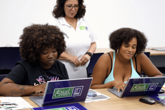 Students with a teacher in a classroom setting